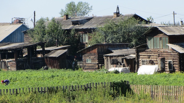 The occasional cluster of buildings, with market gardens, from the Trans-Siberian Express