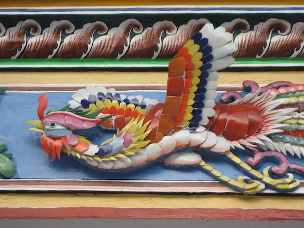 Mosaic over the door arch at the Yeng Keng hotel