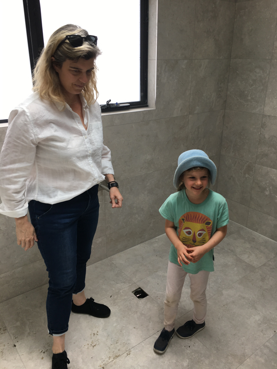Bronwyn and Berrima examine the bathroom tiling