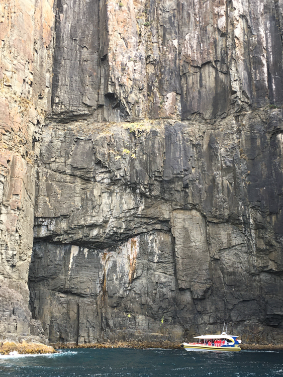 Exploring a cave, off Bruny Island