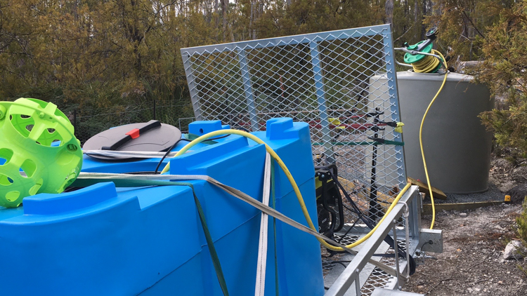 Pumping rainwater from the trailer into the irrigation tank