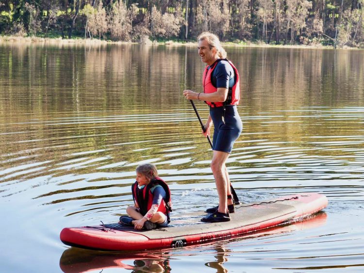 Reinhard and Berrima on a Stand Up Paddleboard at North Durras NSW