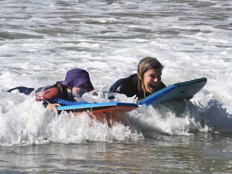 Berrima and Bronwyn boogie-boarding at Lilli Pilli NSW