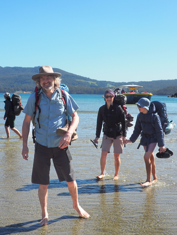 Reinhard disembarking the Pennecott landing craft at Denman's Cove