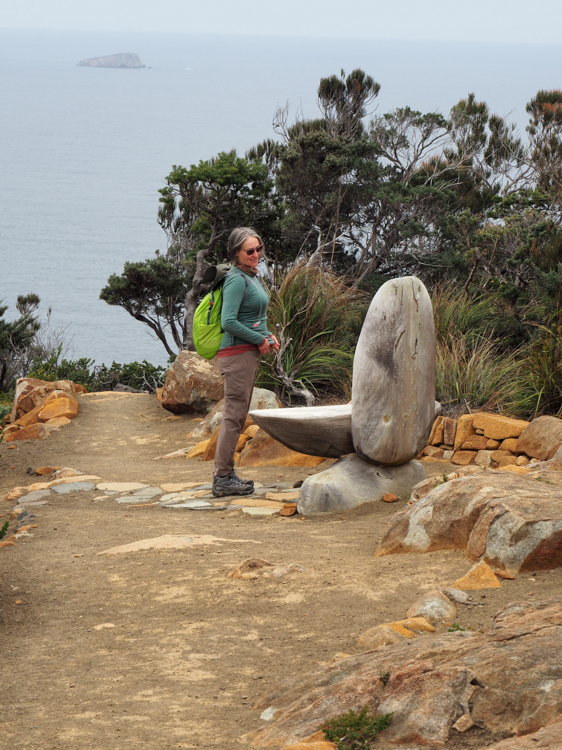 Elizabeth examines a seat on Cape Pillar, at the end of the Three Capes Track