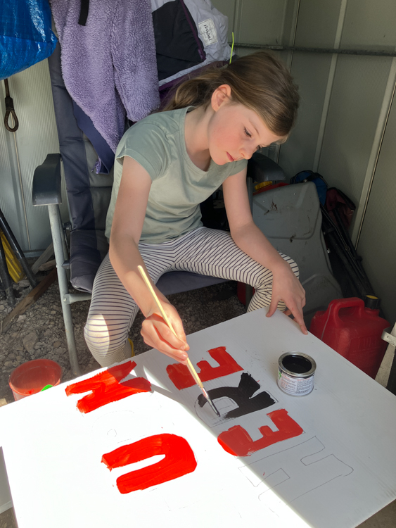 Berrima painting a sign