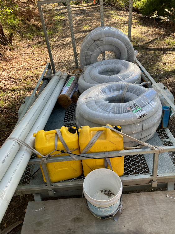 A trailer full of drainage pipes