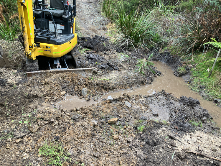 Digging the trench across the creek crossing