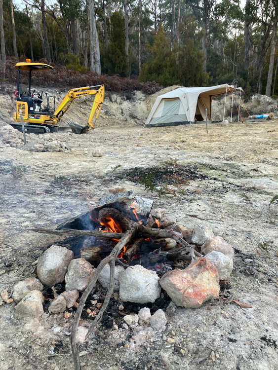 Digger, tent, and campfire