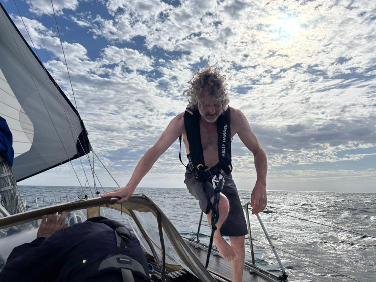 Reinhard makes some morning repairs in the Bass Strait
