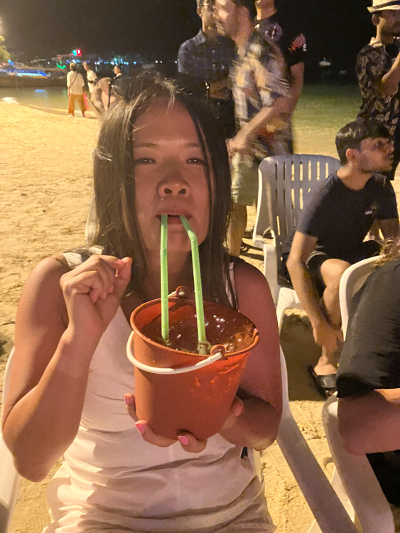 Vananh and a bucket of gin, on Phi Phi Island