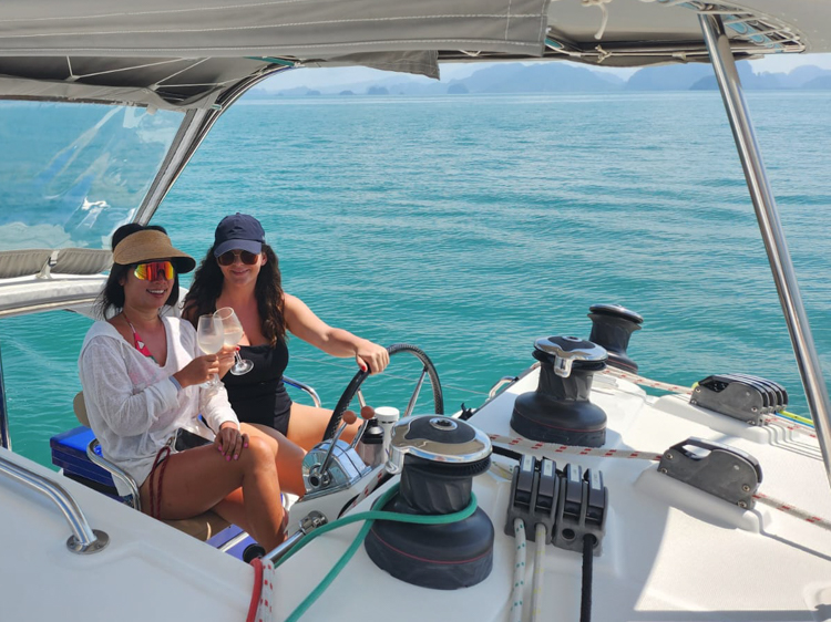 Vananh and Ivana at the helm of Eos, off Ko Yao Noi