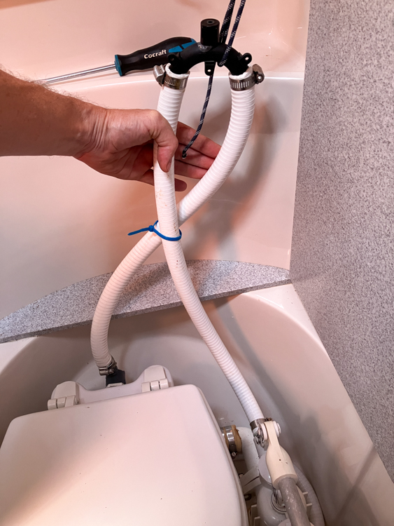 Vented loop on the inlet to the toilet pump